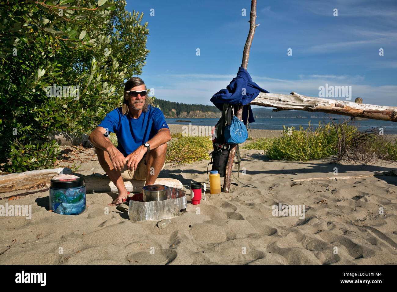 WASHINGTON - Cooking dinner at campsite on beach at Toleak Point on a wilderness section of the Pacific Coast in Olympic NP. Stock Photo