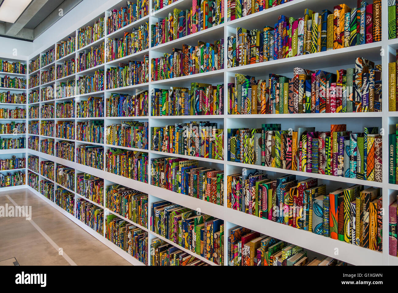 The British Library by Yinka Shonibare MBE Thousands of books covered in batik Dutch fabric with names of notable British people Stock Photo