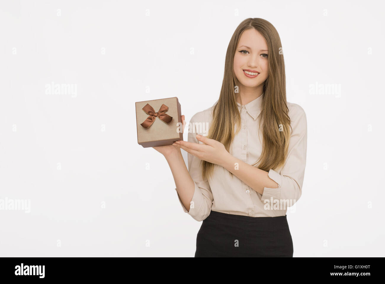 Young woman portrait holding gift Stock Photo - Alamy