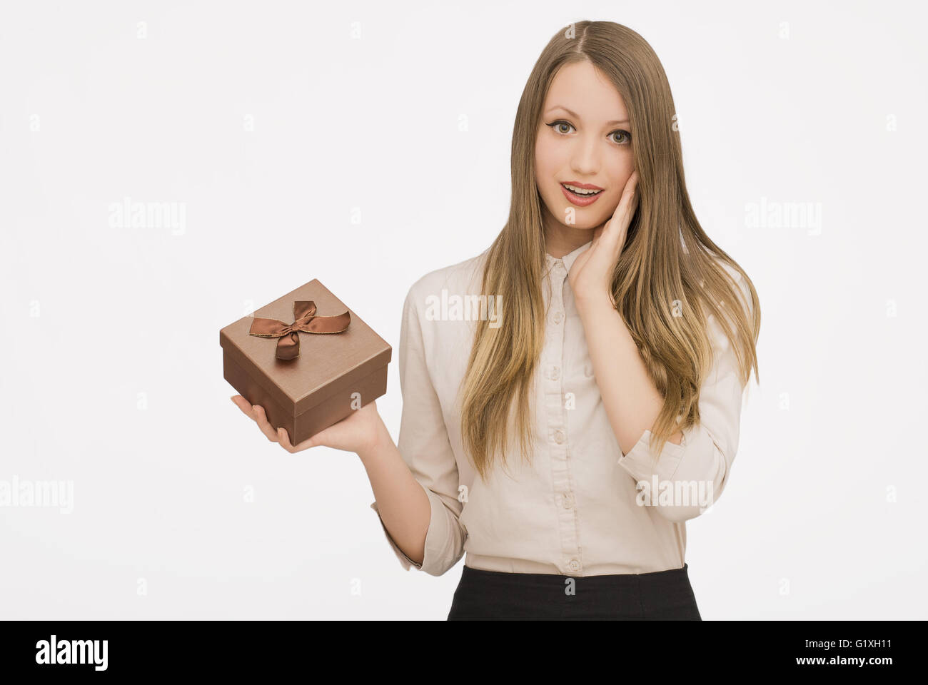 Young woman portrait holding gift Stock Photo - Alamy