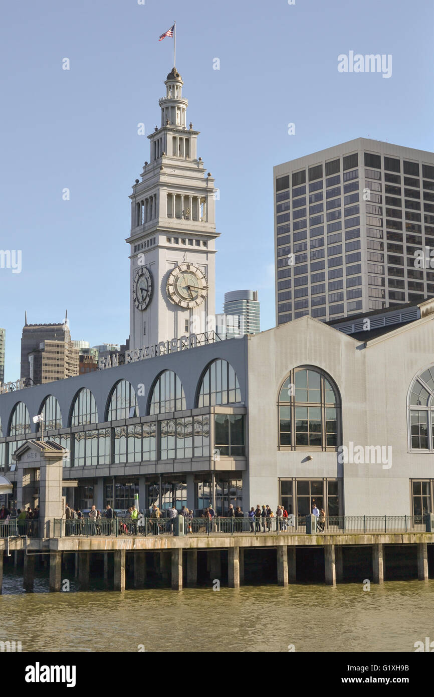 In the end of the day people line up at the Ferry Building in San Francisco to take the ferry home Stock Photo