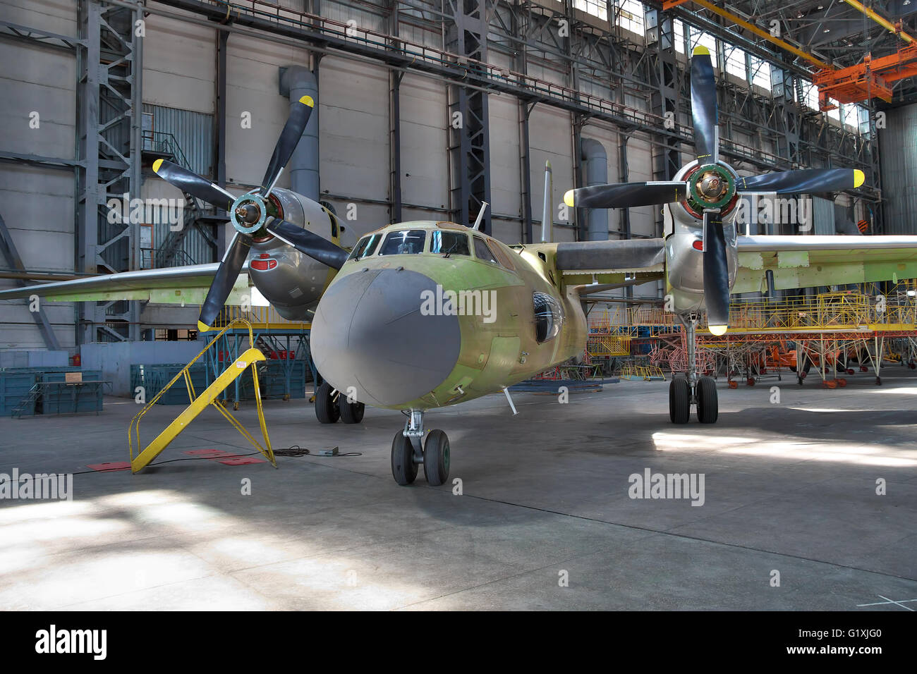 Kiev, Ukraine - August 3, 2011: Antonov An-32 cargo plane being assembled at the aircraft manufacturing hangar Stock Photo