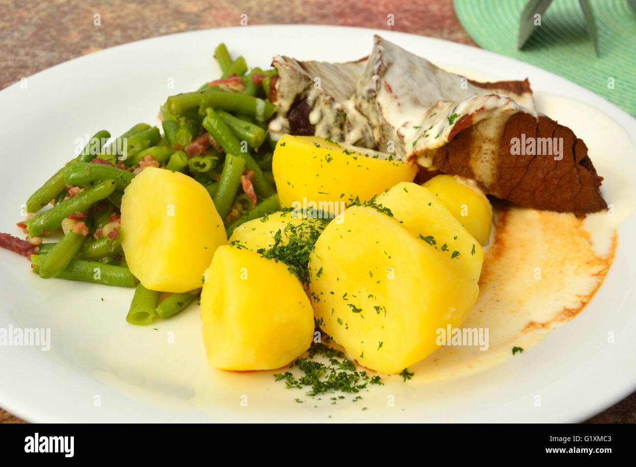 Smoked boiled beef with horseradish sauce, slice beans and boiled potatoes Stock Photo