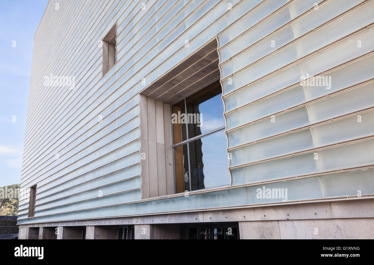 The semi-transparent ribbed facade with three square windows of the Palacio de Congresos Kursaal in San Sebastian, Spain against a clear blue sky Stock Photo