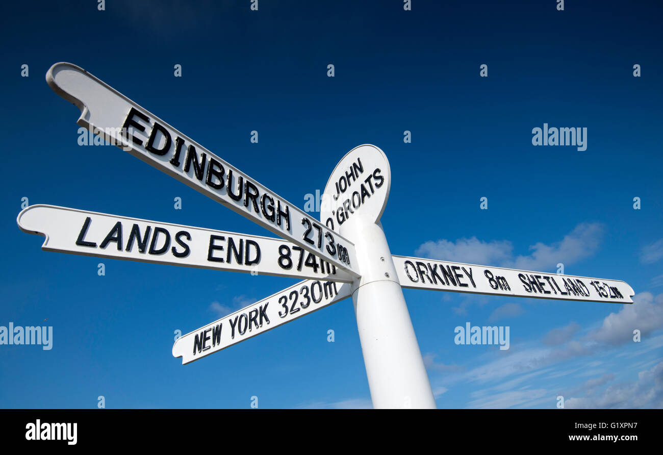 Iconic signpost against a blue sky at John O'Groats, Caithness in Scotland UK Stock Photo