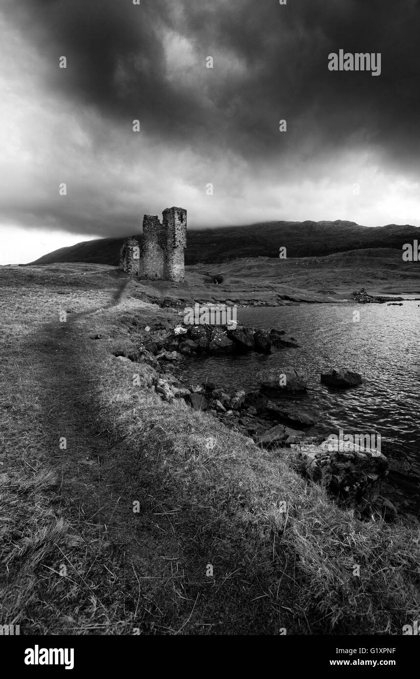 Moody monochrome image of Ardvreck Castle on Loch Assynt, Sutherland Scotland UK Stock Photo