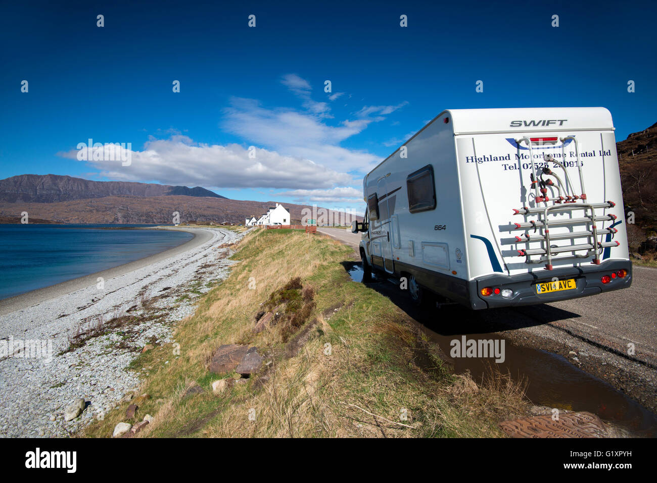 Motorhome parked up by the deserted beach at Ardmair Bay near Ullapool, Wester Ross Scotland UK Stock Photo