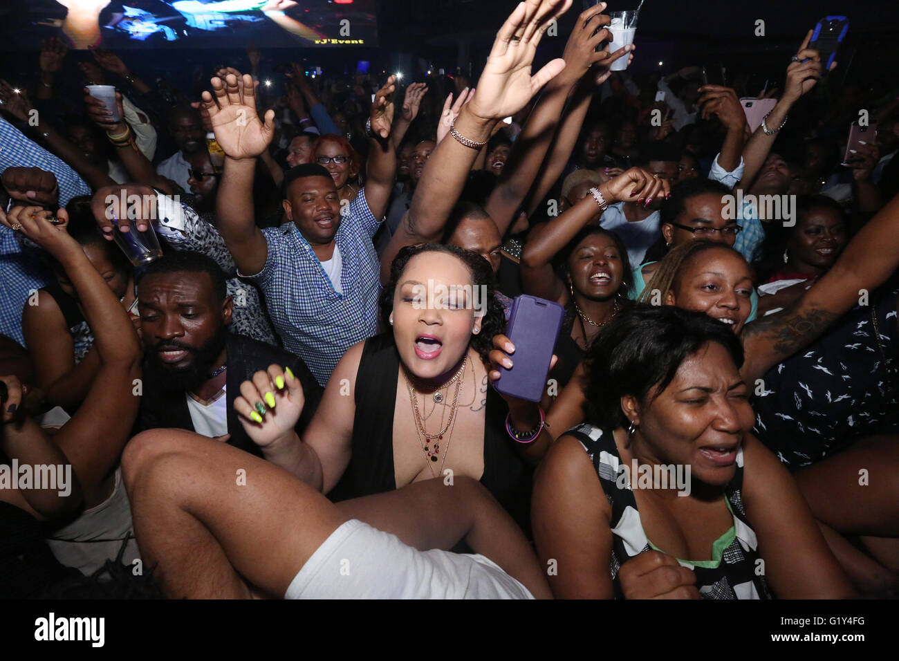 Audience sings and dances during Michel 'Sweet Micky' Martelly debut show in  Renaissance Concert Series at Cafe Iguana Pines. Stock Photo