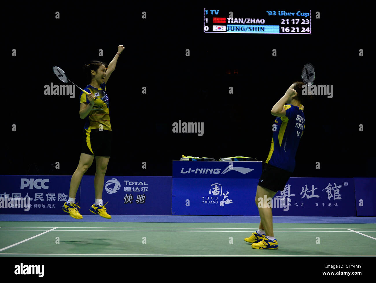 Kunshan, China's Jiangsu Province. 21st May, 2016. Jung Kyung Eun (L) and Shin Seung Chan of South Korea celebrate after beating Tian Qing and Zhao Yunlei of China in the women's doubles match of the Uber Cup badminton championship final in Kunshan, east China's Jiangsu Province, May 21, 2016. © Li Xiang/Xinhua/Alamy Live News Stock Photo