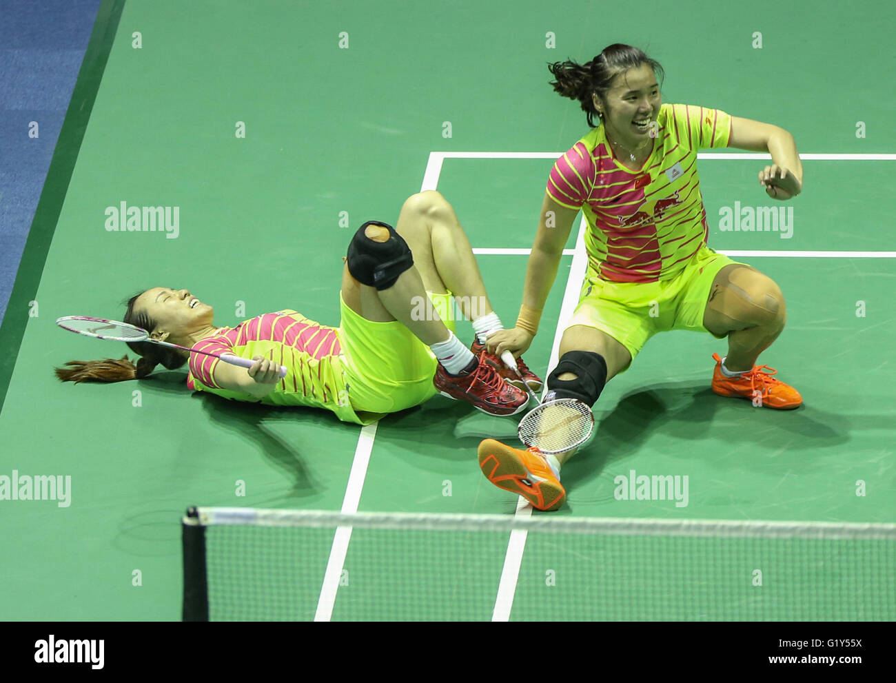 Kunshan, China's Jiangsu Province. 21st May, 2016. Tian Qing (R) and Zhao Yunlei of China fall down together during the women's doubles match against Jung Kyung Eun and Shin Seung Chan of South Korea at the Uber Cup badminton championship in Kunshan, east China's Jiangsu Province, May 21, 2016. China won the title by 3-1. © Yang Lei/Xinhua/Alamy Live News Stock Photo