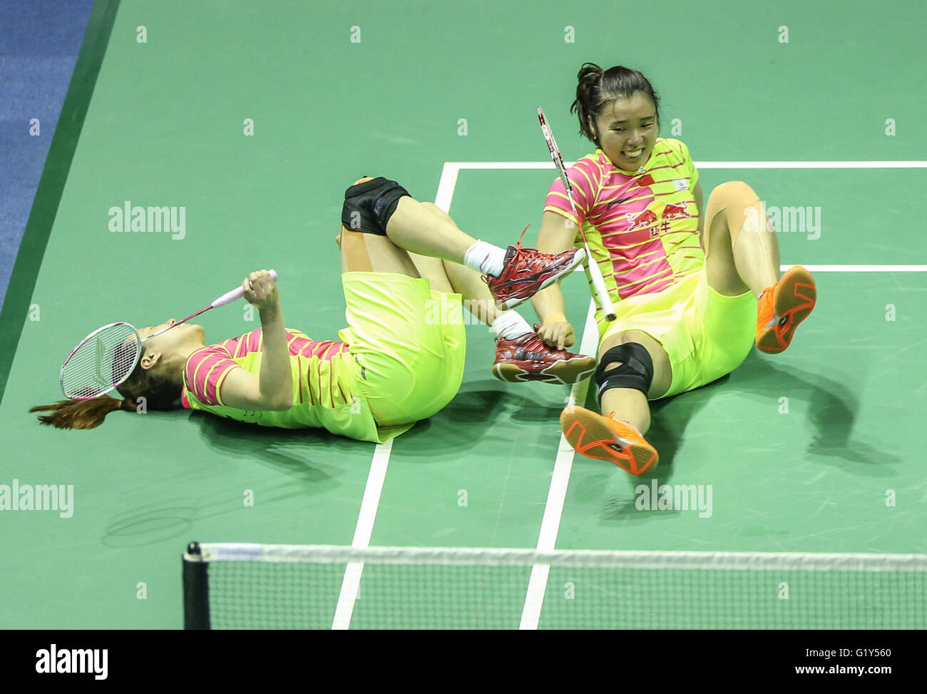 Kunshan, China's Jiangsu Province. 21st May, 2016. Tian Qing (R) and Zhao Yunlei of China fall down together during the women's doubles match against Jung Kyung Eun and Shin Seung Chan of South Korea at the Uber Cup badminton championship in Kunshan, east China's Jiangsu Province, May 21, 2016. China won the title by 3-1. © Yang Lei/Xinhua/Alamy Live News Stock Photo