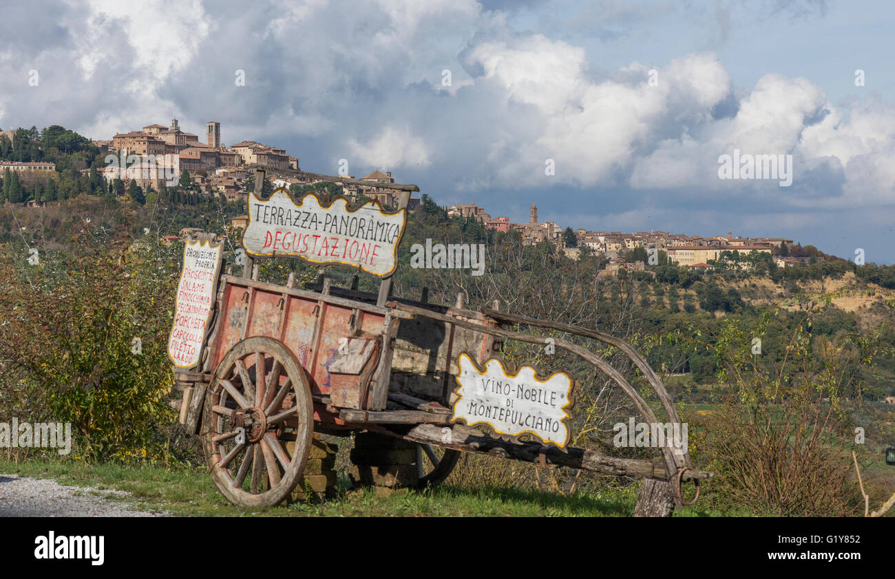 traditional cart for wine transport in front of Montepulciano skyline Stock Photo