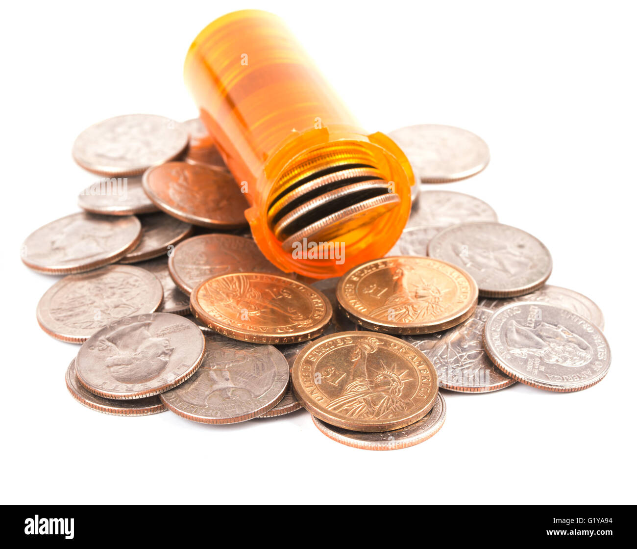 Medicine bottle filled with money, on top of a heap of quarters and dollar coins, concept of expensive medical care; on white Stock Photo