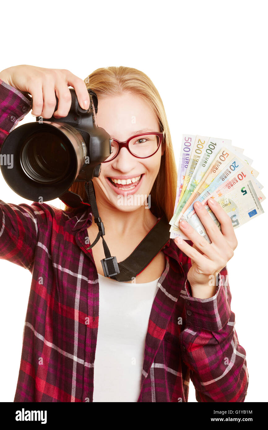 Happy woman with camera earning money with photography Stock Photo