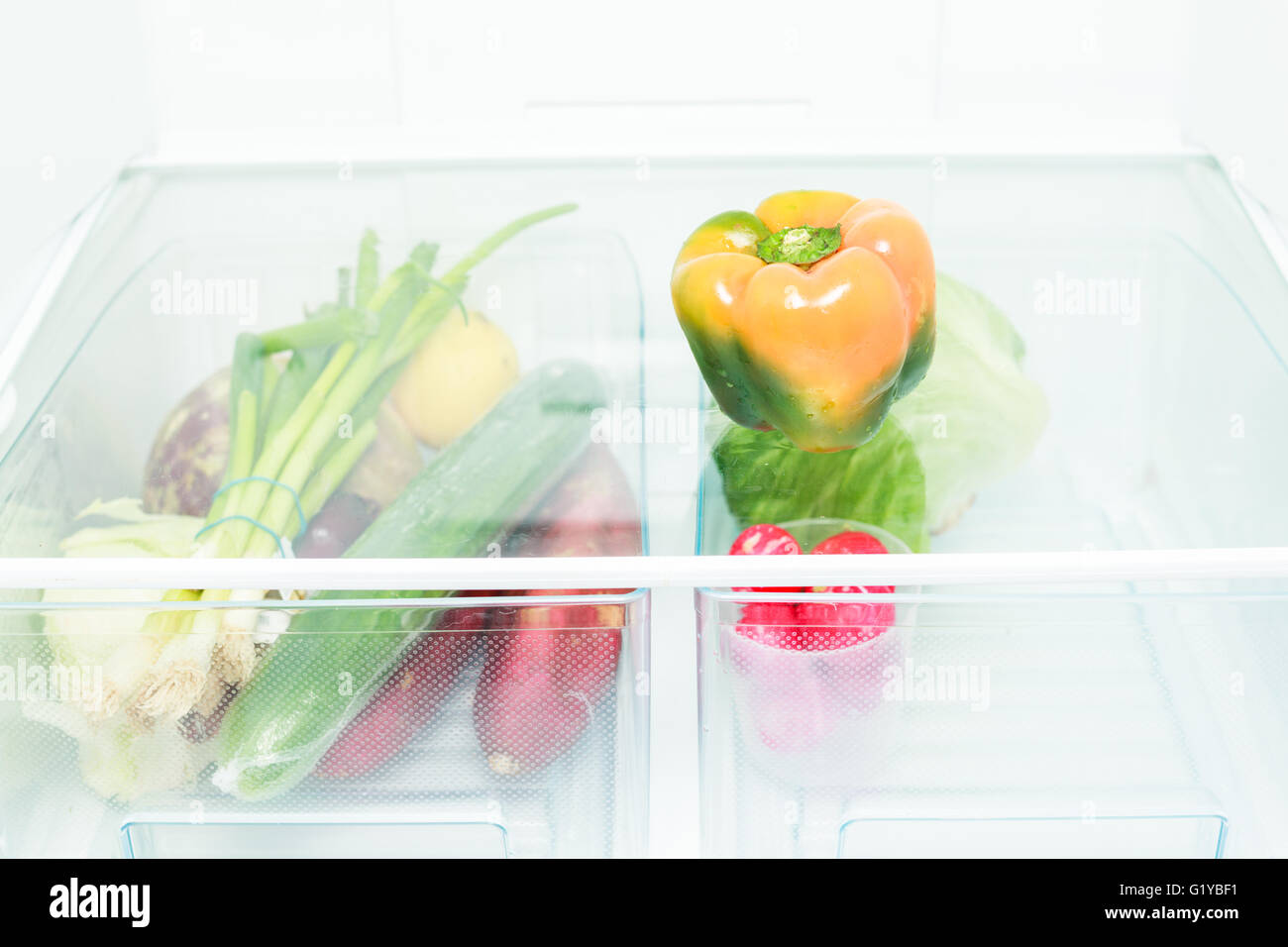 A bunch of different vegetables in a refrigerator Stock Photo