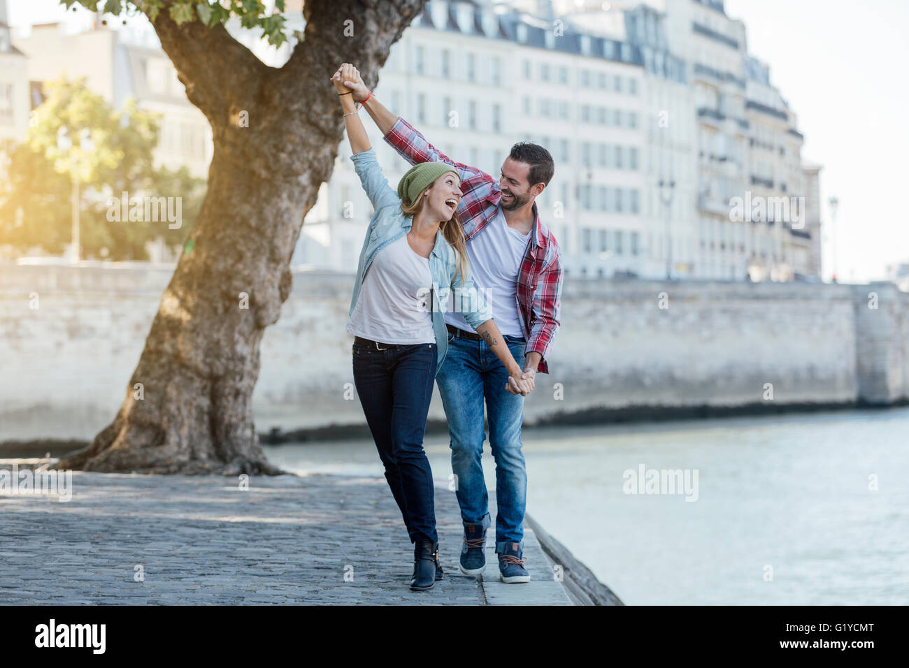 Smart couple holding hands hi-res stock photography and images - Alamy