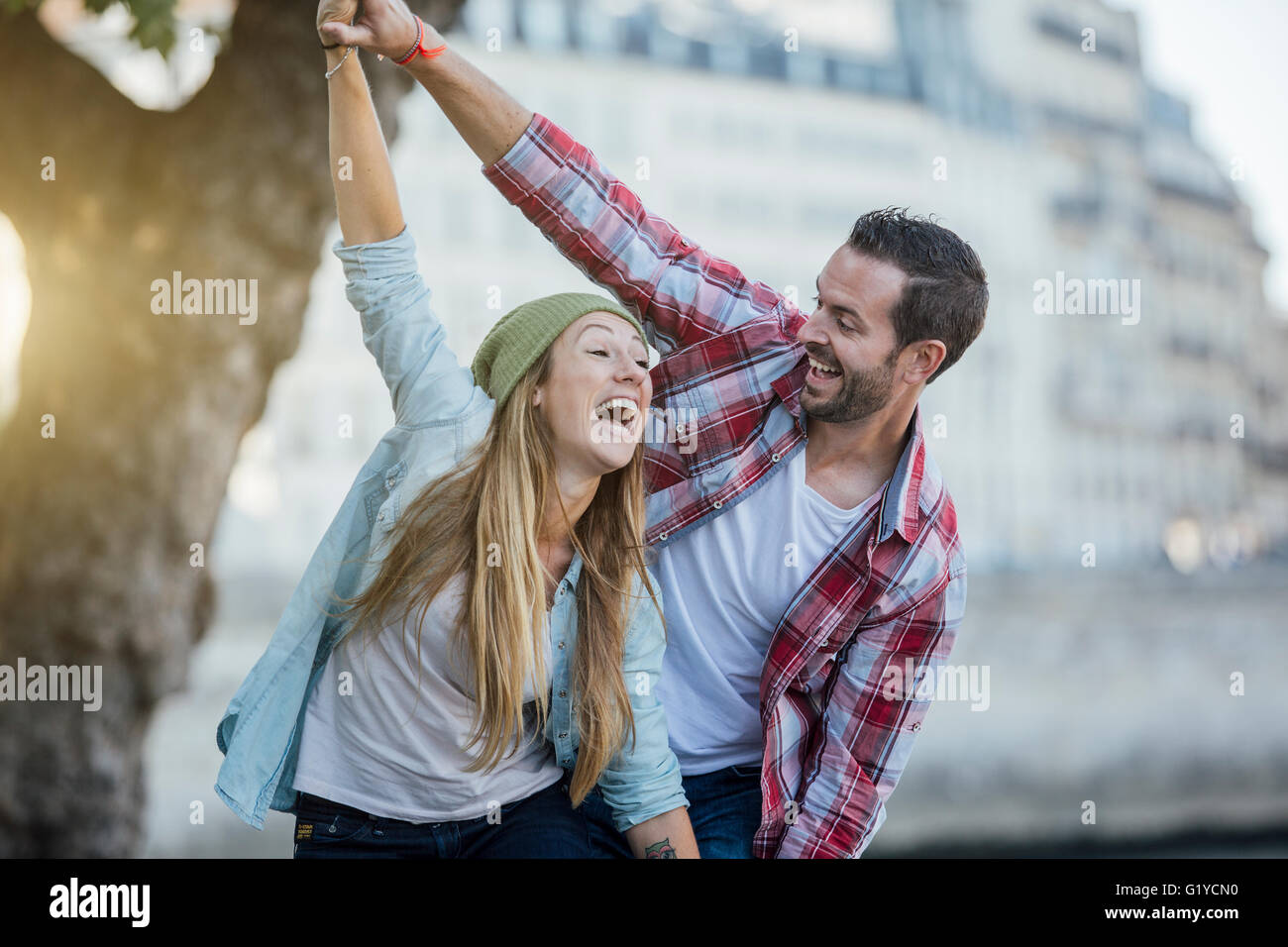 Smart couple holding hands hi-res stock photography and images - Alamy