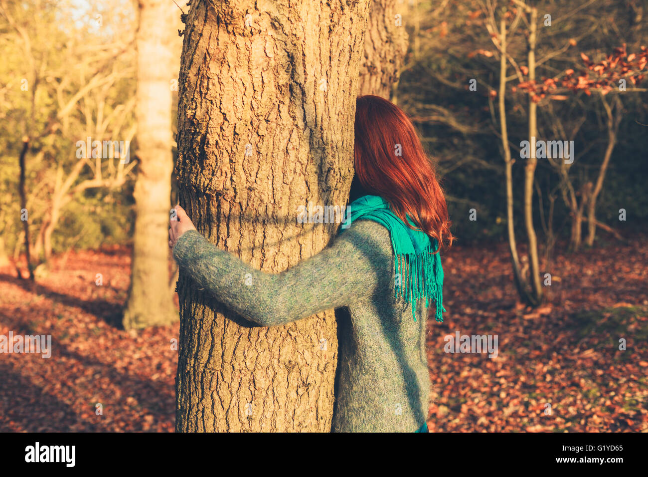 Woman young arms around embracing hi-res stock photography and images ...