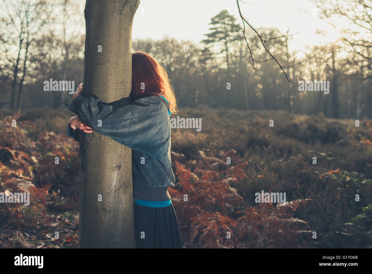 Woman young arms around embracing hi-res stock photography and images ...