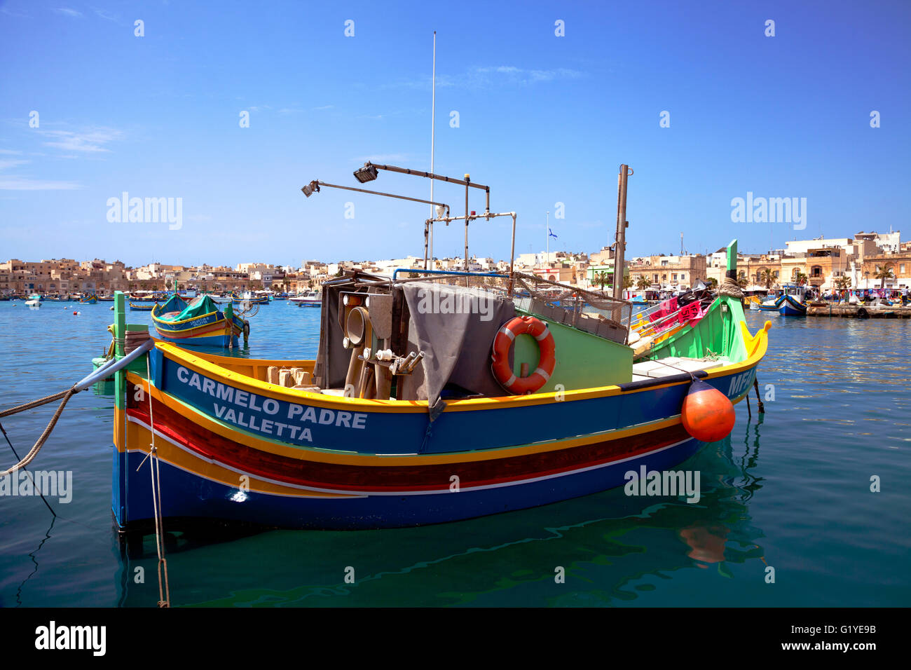 Luzzu, typical colorful fishing boat, port of Marsaxlokk, Malta Stock Photo