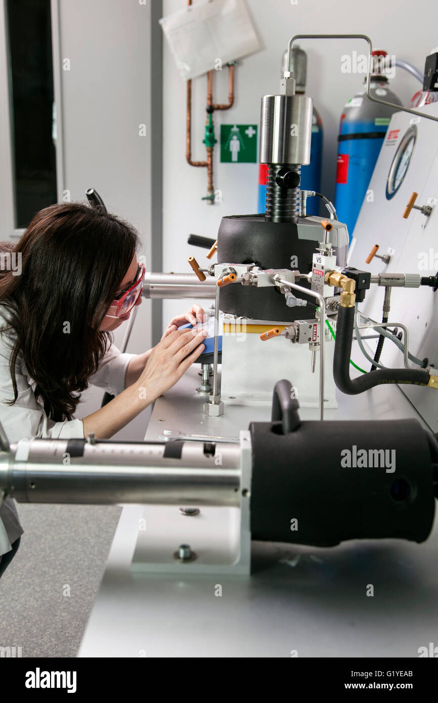 Geologist at the high-pressure apparatus in the laboratory. Stock Photo