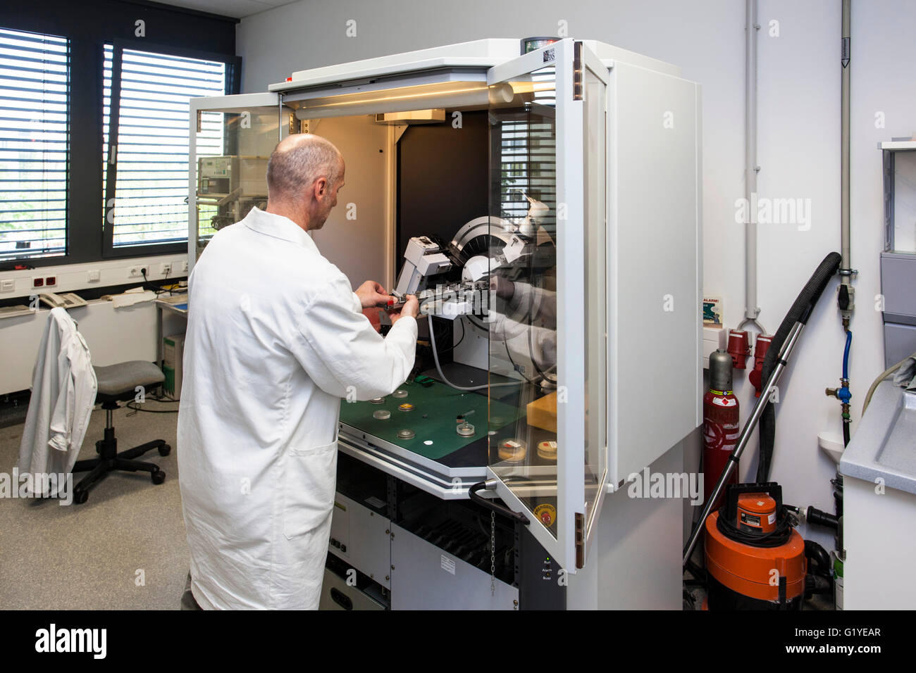 Geologist at the X-ray machine Stock Photo