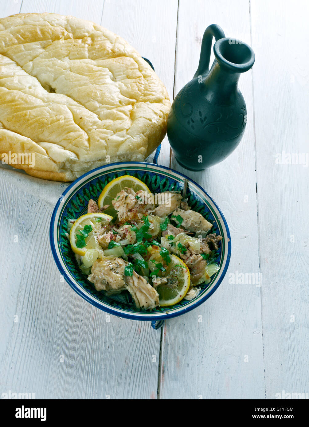 Moroccan Chicken Place the onion, parsley, coriander, lemon juice, garlic, cumin Stock Photo