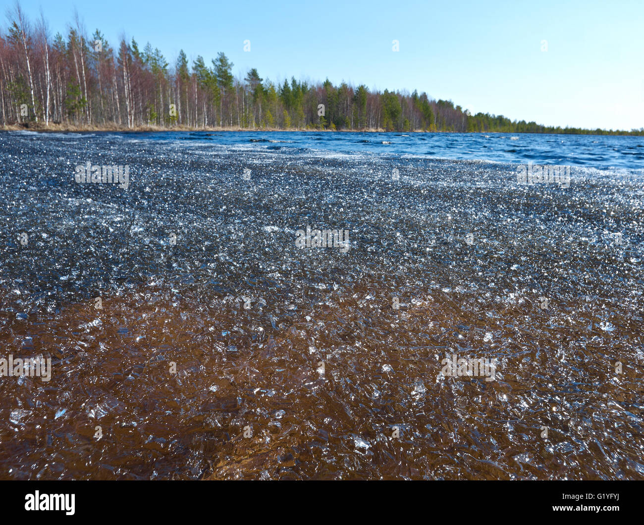 Russian Spring landscape with flooded.icy slush on the water of the ...