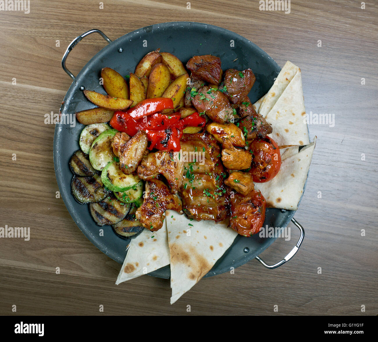 Shashlik - shish kebab. Various types mat roasted with vegetable closeup  Stock Photo - Alamy
