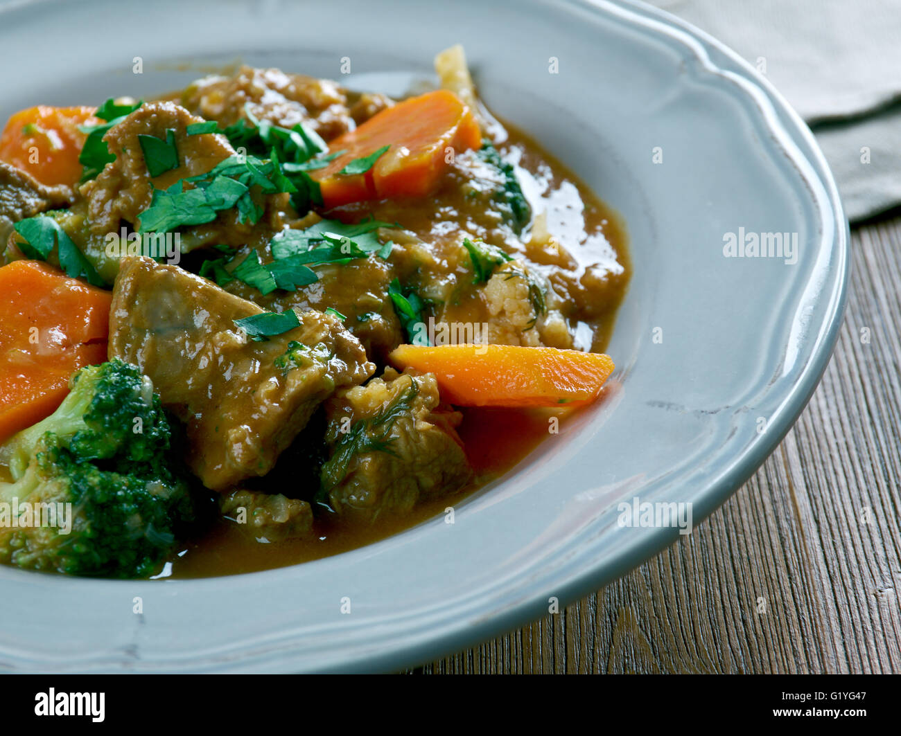 Rindfleisch Altbiereintopf -  German traditional beef stew with carrots, dark beer Stock Photo