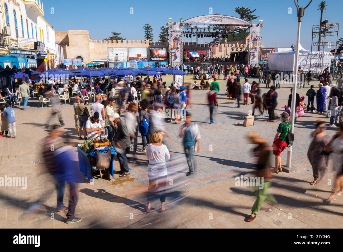 Audience members and main stage in the town's main square at the Essaouira music festival in Morocco Stock Photo