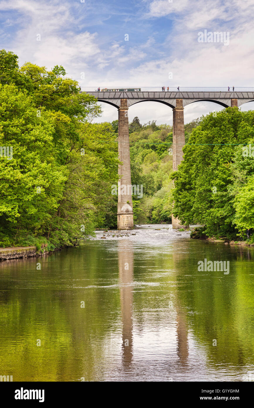 Pontcysyllte Aqueduct, built by Thomas Telford, and a World Heritage Site, reflecting in the River Dee, with a narrowboat and... Stock Photo