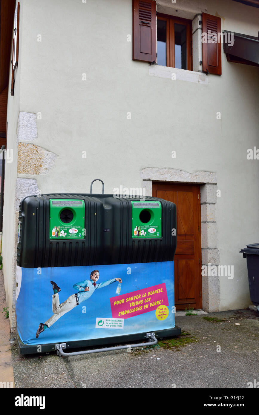 Large municipal recycling container right next to house door, France Stock Photo