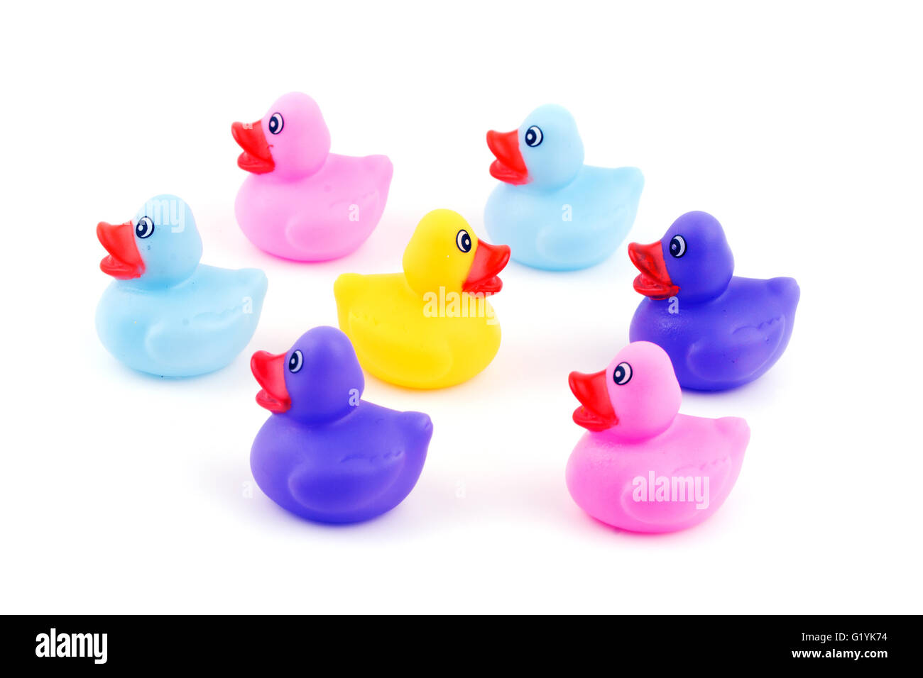 Group of rubber ducklings with one going to opposite direction - concept of individuality Stock Photo