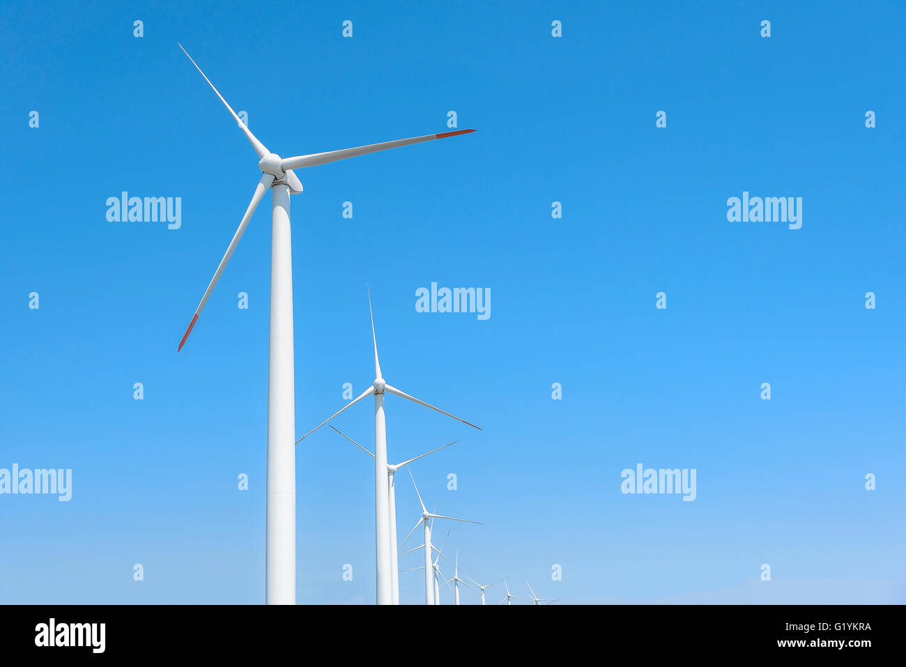 Power generation wind turbines against the blue sky with clouds Stock ...