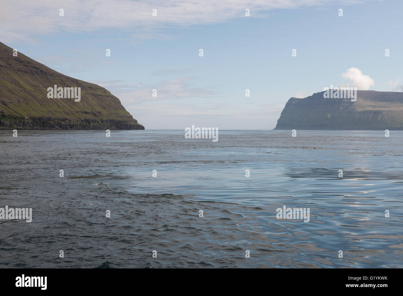 Typical landscape on the Faroe Islands, with Fugloy and Svinoy as seen from the sea Stock Photo