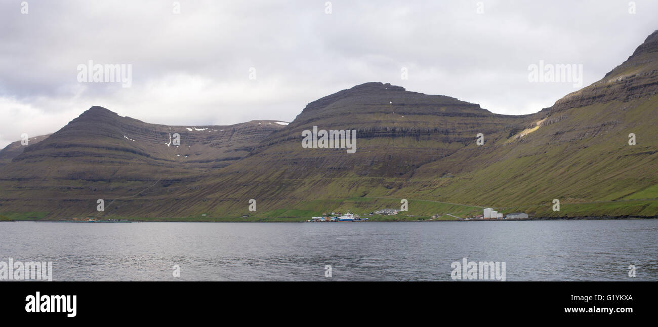 Fishing harbor just outside of Klaksvik on the Faroe Islands with mountains of Bordoy Stock Photo
