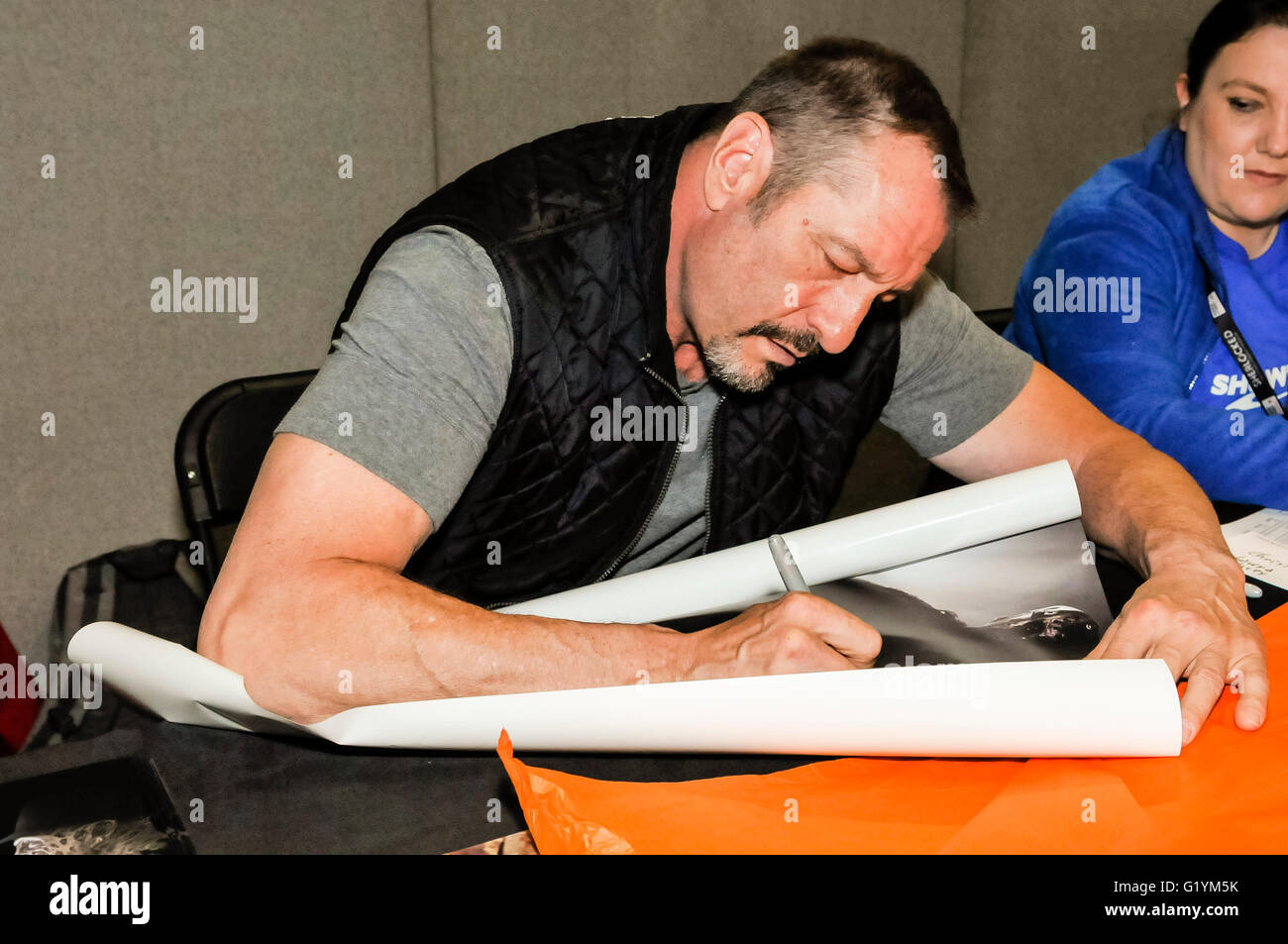 Ken Kirzinger, who played Jason Voorhees in the 2003 film 'Freddy vs. Jason' signs autographs for fans at Comicon Belfast, Northern Ireland, 14 May 2016 Stock Photo