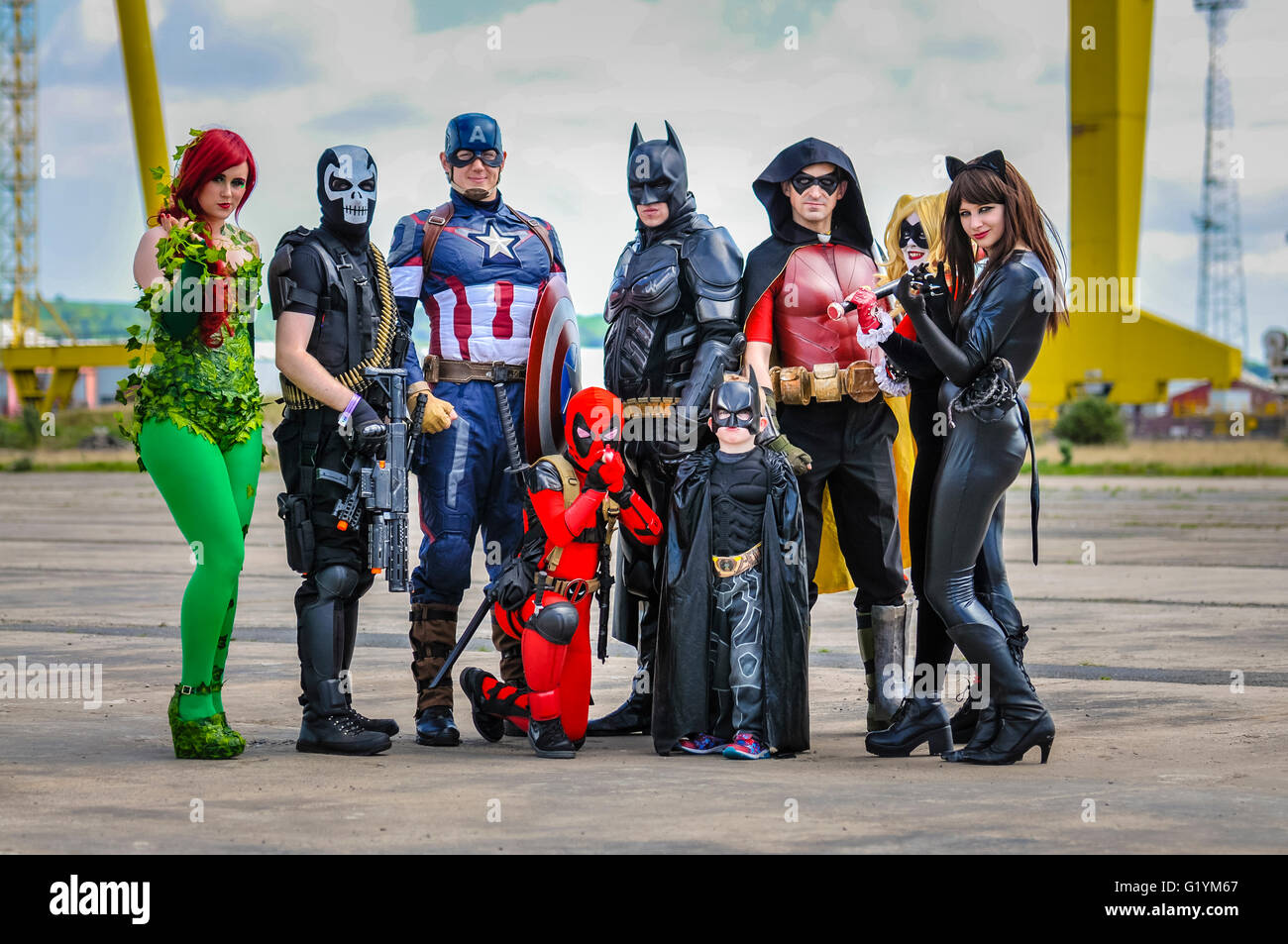Superheroes gather in Belfast at Comicon Belfast, Northern Ireland, 14 May 2016 (Poison Ivy, Crossbones, Captain America, Batman, Robin, Harley Quinn, Catwoman.  [front] Deadpool, Batman (children)) Stock Photo