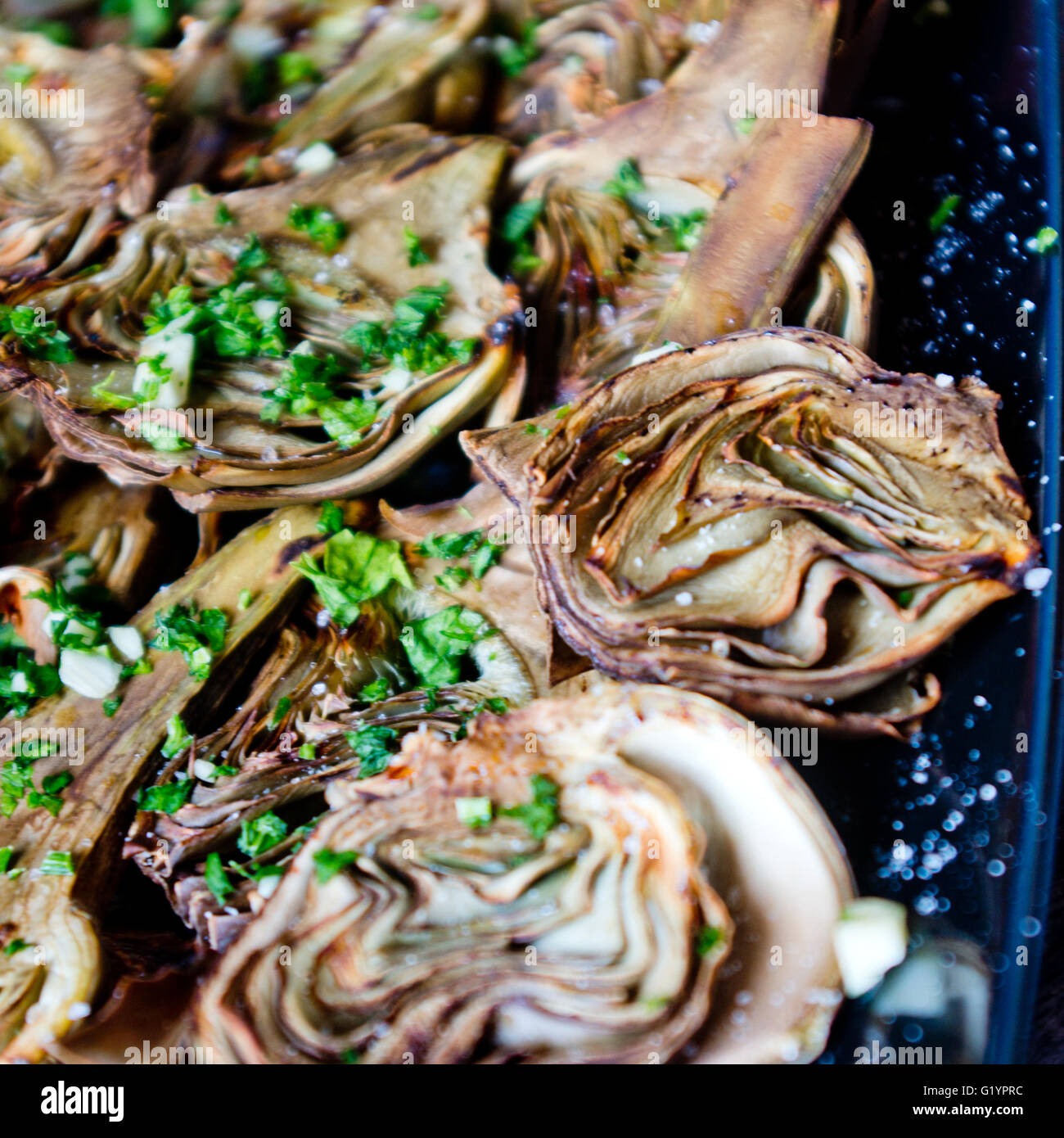 artichokes baked in oven seasoned only with extra virgin olive oil, parsley and lemon are a