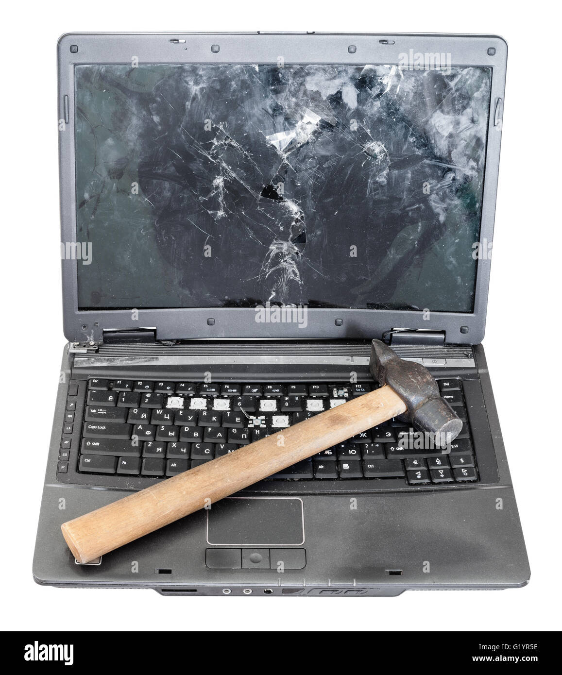front view of old broken laptop with hammer on keyboard isolated on white background Stock Photo