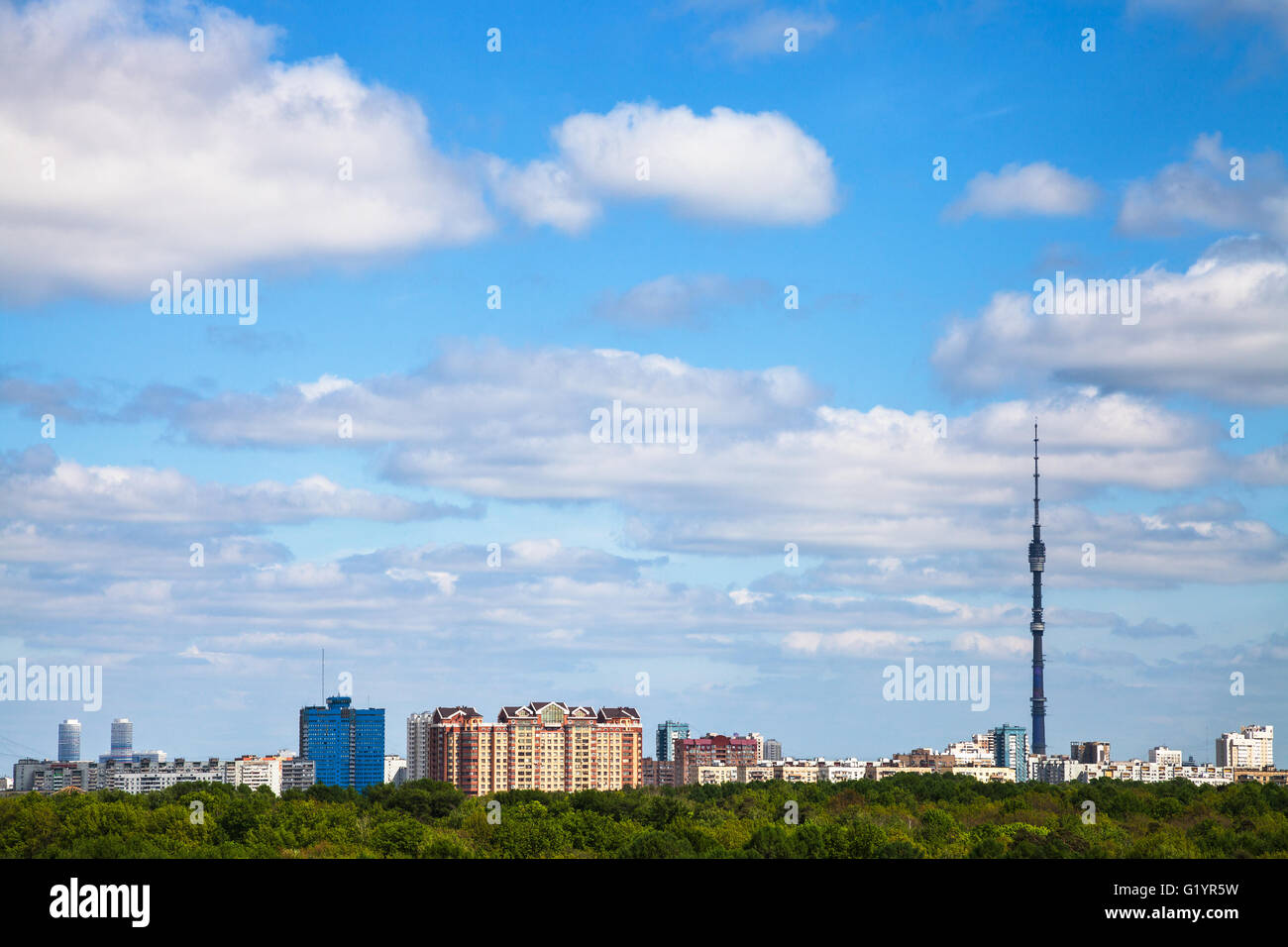 city and green forest under cloudy blue sky in summer day Stock Photo ...