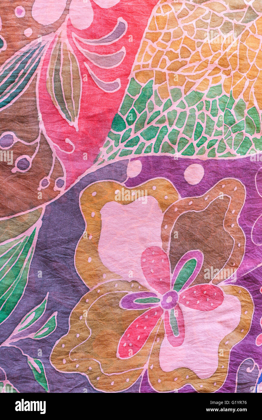 textile background - abstract hand painted floral pattern on pink and purple silk batik Stock Photo