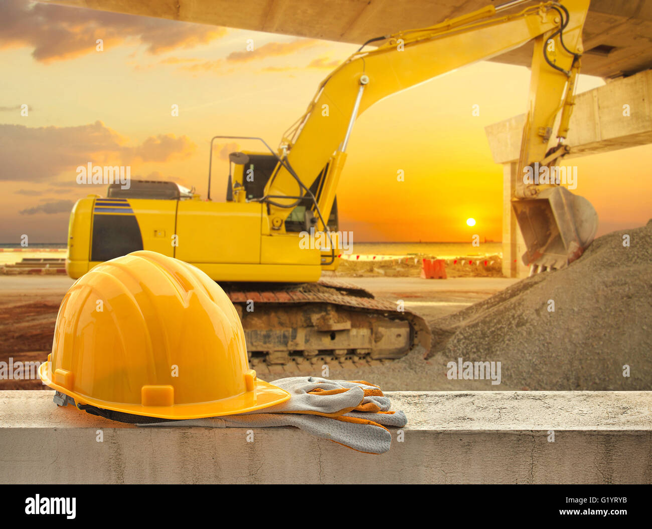 Yellow hard hat on construction site Stock Photo Alamy