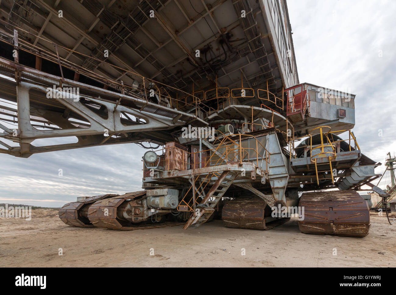 Cab and career caterpillar excavator. Many buckets of giant quarry