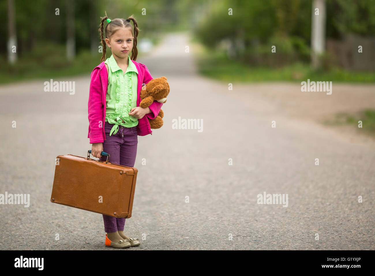 Little girl with discount suitcase