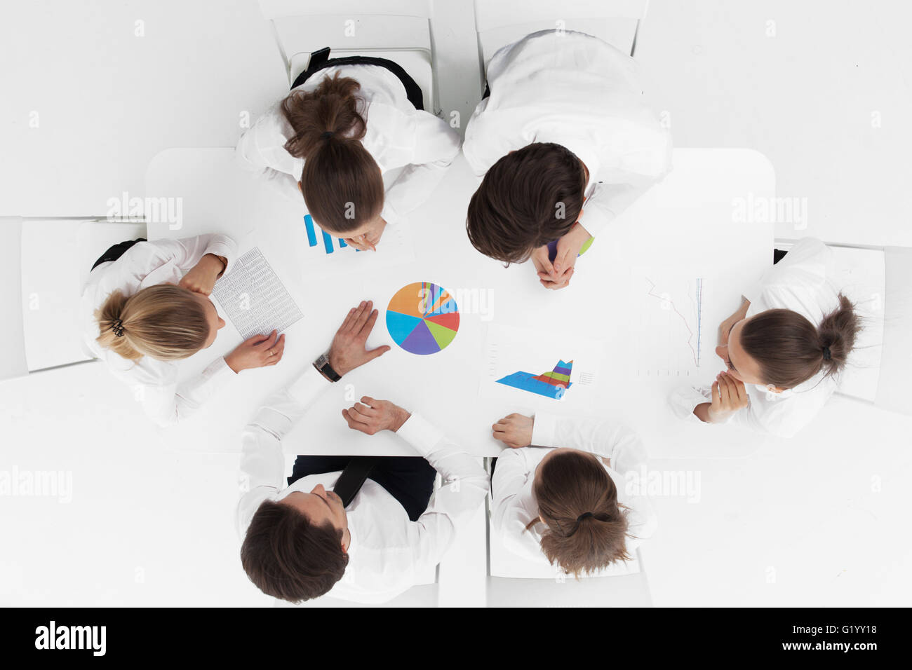 Top view of business people working with financial reports Stock Photo