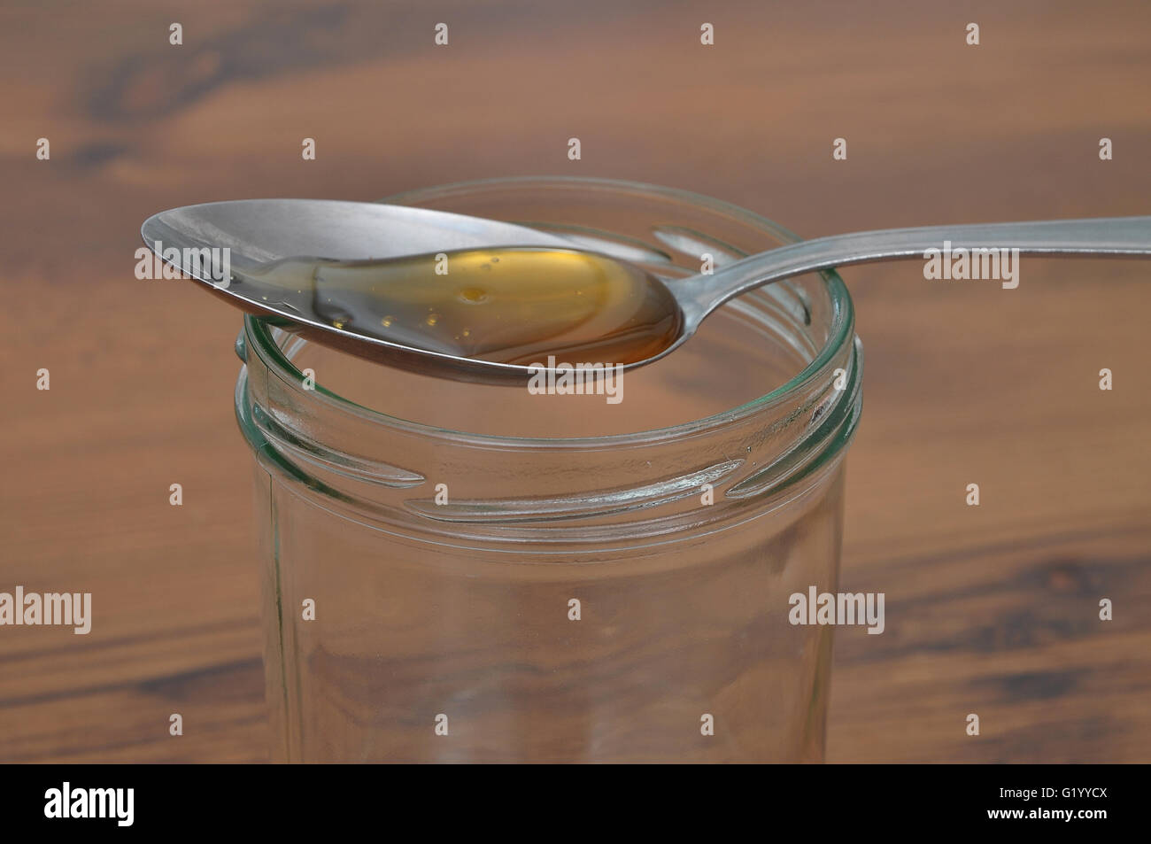 Spoon with honey Stock Photo