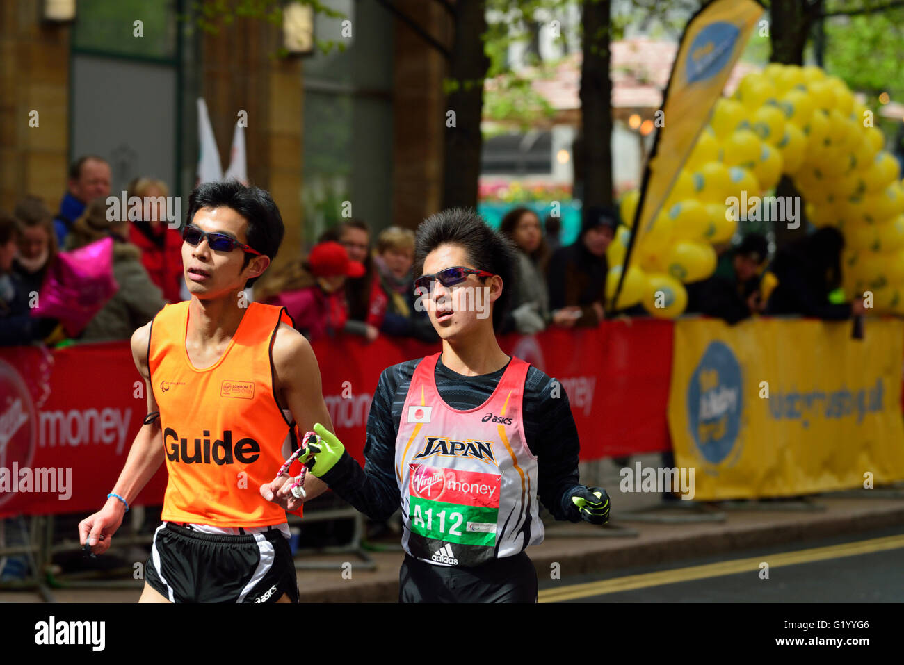 Visually impared competitor with Guide, 2016 Virgin Money London Marathon, London, United Kingdom Stock Photo