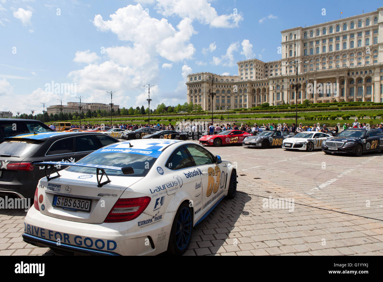 Super cars of the exclusive Gumboil 3000 parked in front of the Romanian Parliament. Gumball is an international celebrity rally Stock Photo